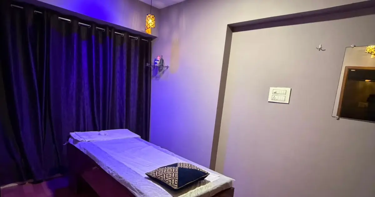 A private massage room at ILA Spa with soft lighting and fresh linen